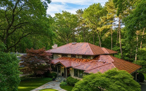 Residential home exterior surrounded by trees