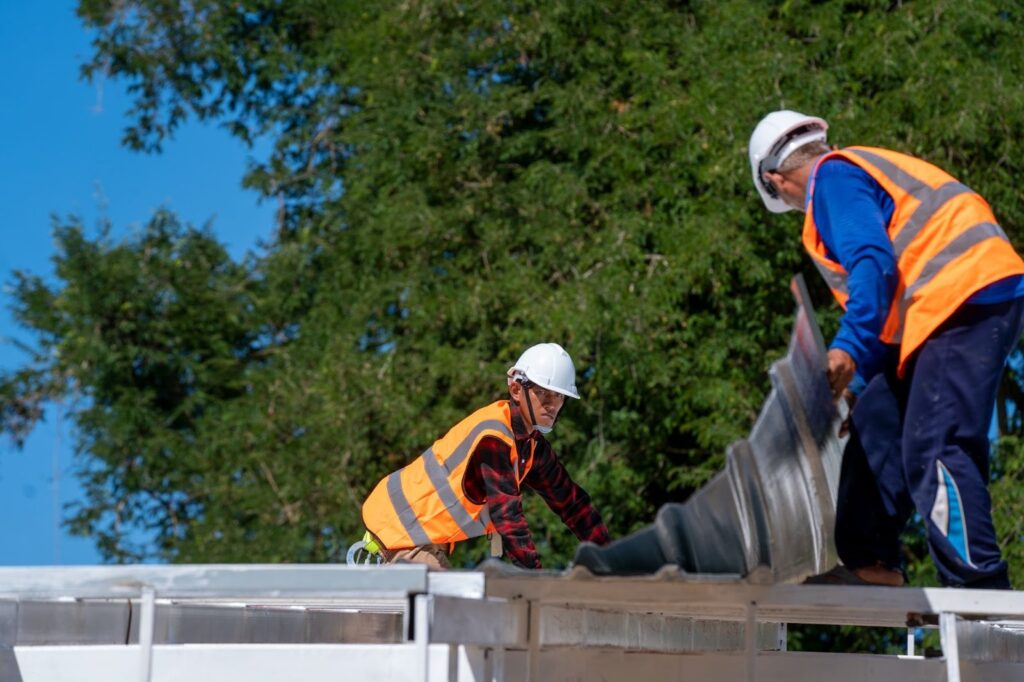 professionals at work on a roof