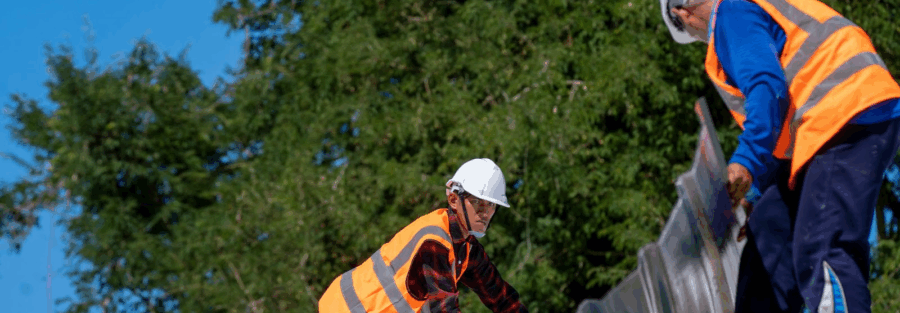 roofing professionals at work, representing importance of roofing and solar contractors