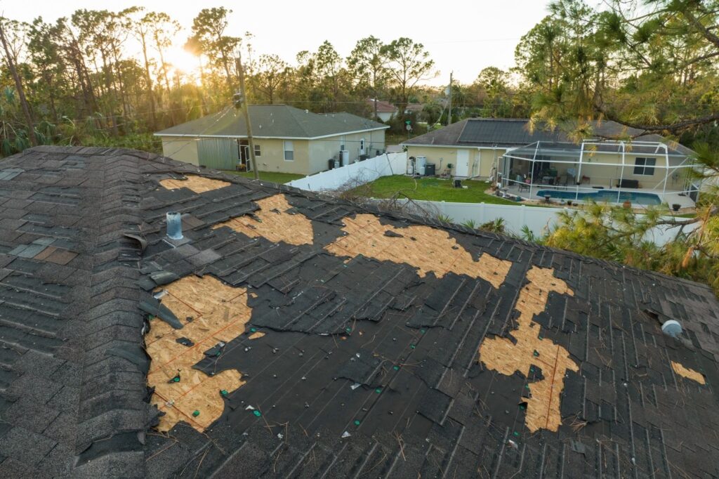 damaged roof with missing shingles