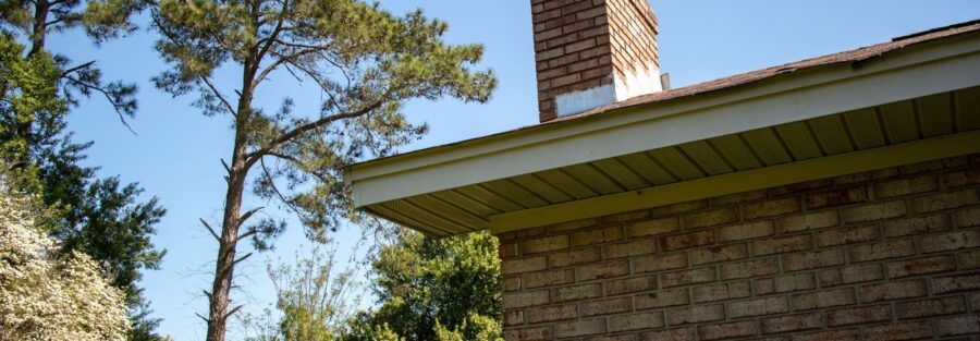 roof with chimney, representing the importance of chimney flashing repair
