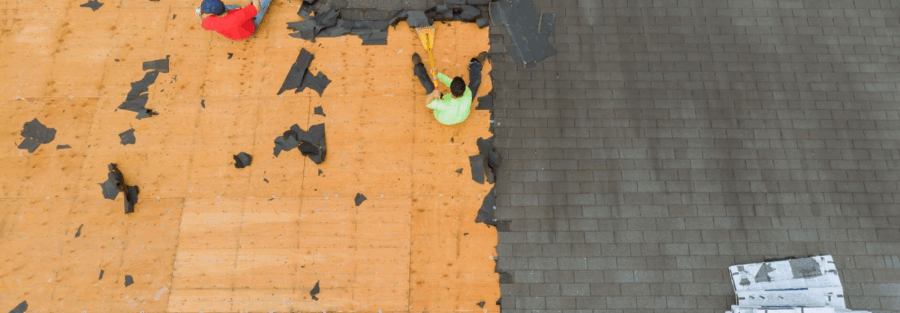 People at work doing roof replacement