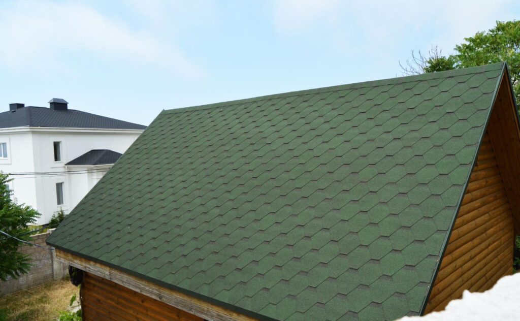 house with green metal tiled roof