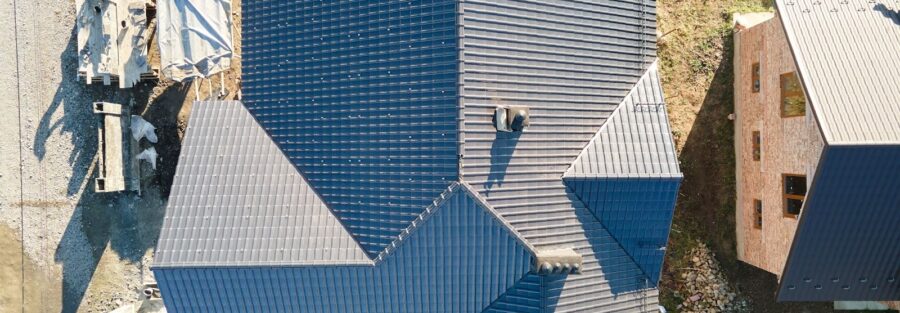 house with metallic shingles, symbolizing the work of top roofing contractors in DFW Texas