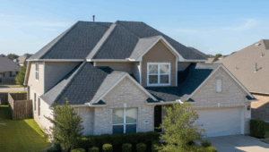 Alt text: suburban DFW home with a freshly installed asphalt shingle roof, representing the question of roof replacement cost in DFW Texas