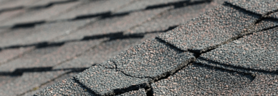 cracked asphalt shingle, underscoring understanding how to repair roof cracks