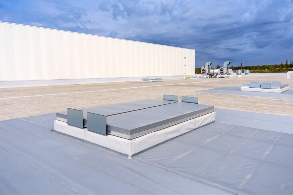White metal sheet rooftop wall on commercial building